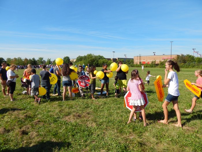 Children got involved blowing up balloons that said “LIFE”.